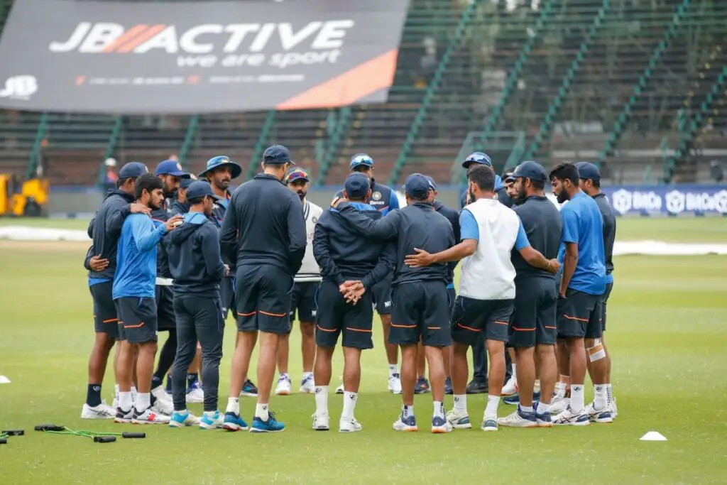 Indian players gather up before play